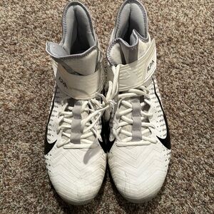 This is a pair of Nike Alpha cleats in size 15